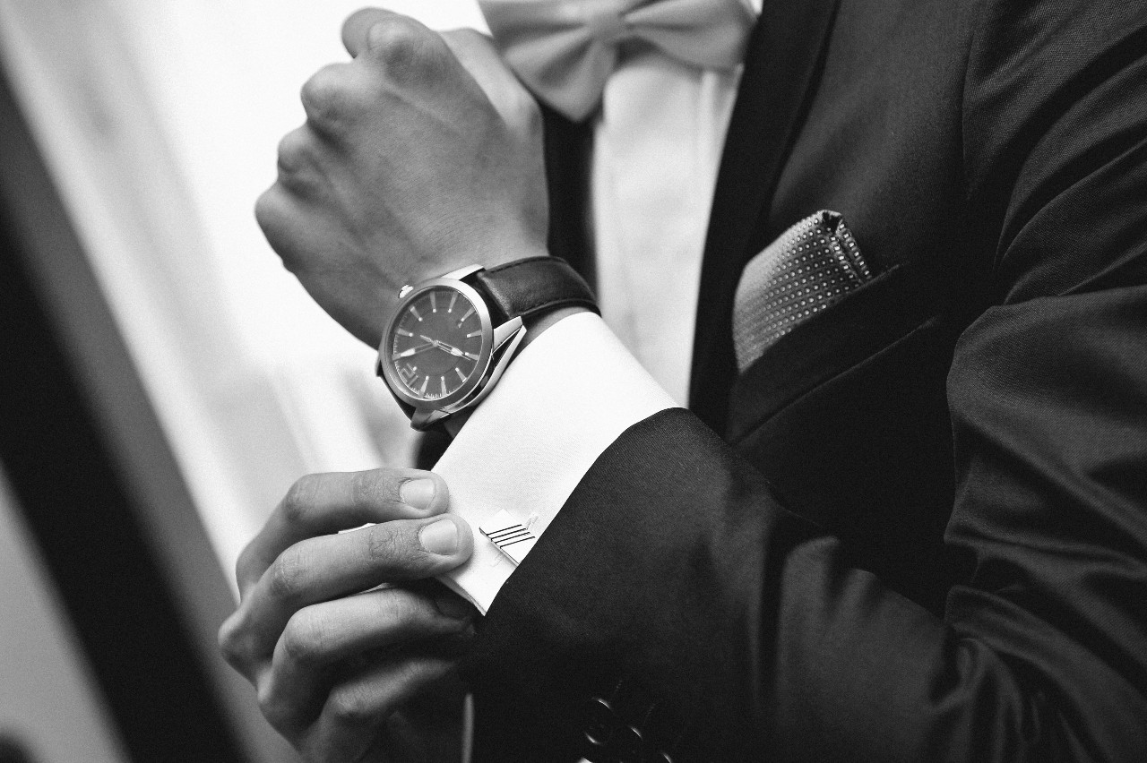Man wearing a suit and a wristwatch
