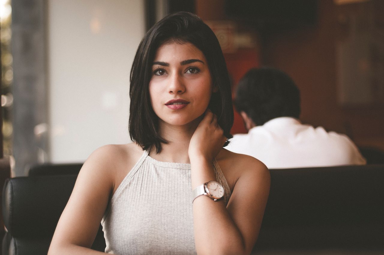 Woman wearing a watch in a restaurant