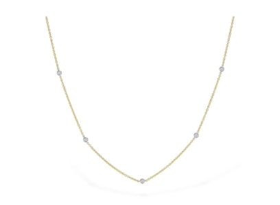 a yellow gold and white gold diamond station necklace from Allison-Kaufman.