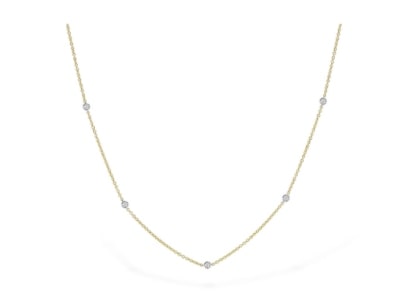 a yellow gold and white gold diamond station necklace from Allison-Kaufman.