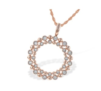 A rose gold circle pendant with diamond accents from Allison-Kaufman.