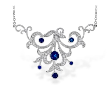 A swirling diamond and sapphire pendant from Allison-Kaufman.