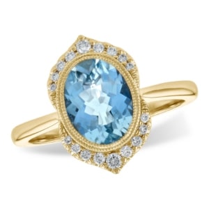 a vintage gold aquamarine ring with diamond details.
