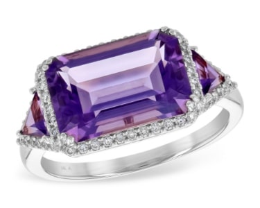 A horizontal-set amethyst fashion ring with diamond accents.