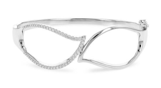 a white gold bangle featuring leaf motifs and diamond accents