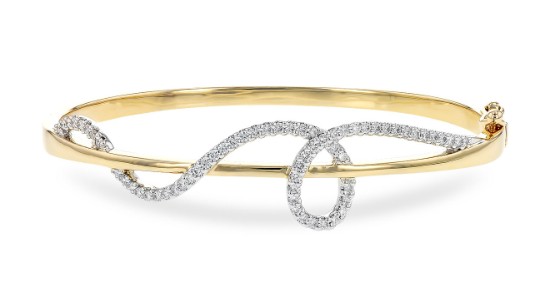 a mixed metal bracelet featuring yellow and white gold and diamonds