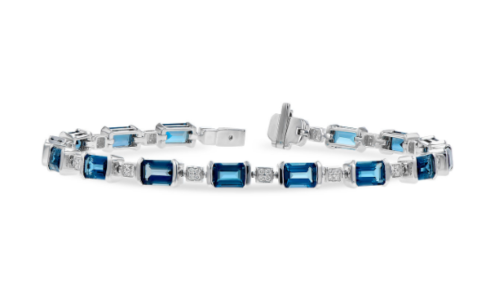 An elegant diamond and blue topaz bracelet from Allison-Kauffman, available at Pucci’s Jewelers.