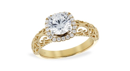 A vintage-inspired halo engagement ring with a uniquely detailed band, available at Pucci’s Jewelers.