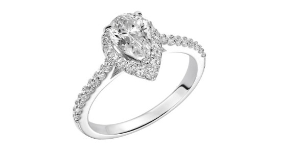 A pear cut halo engagement ring with side stones, available at Pucci’s Jewelers.