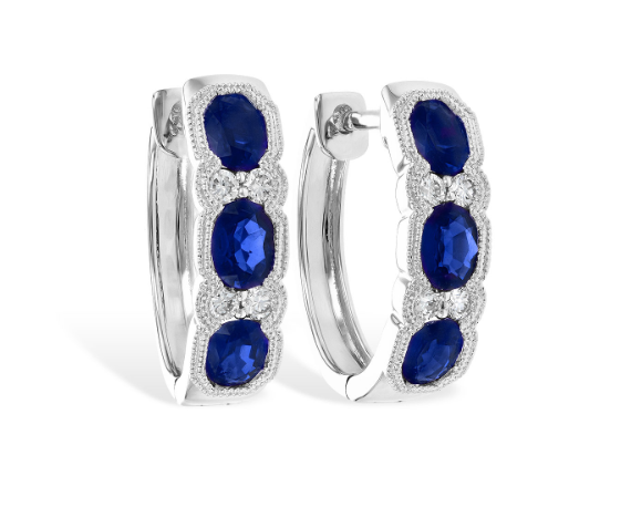 A white gold hoop earrings with oval sapphires and diamonds